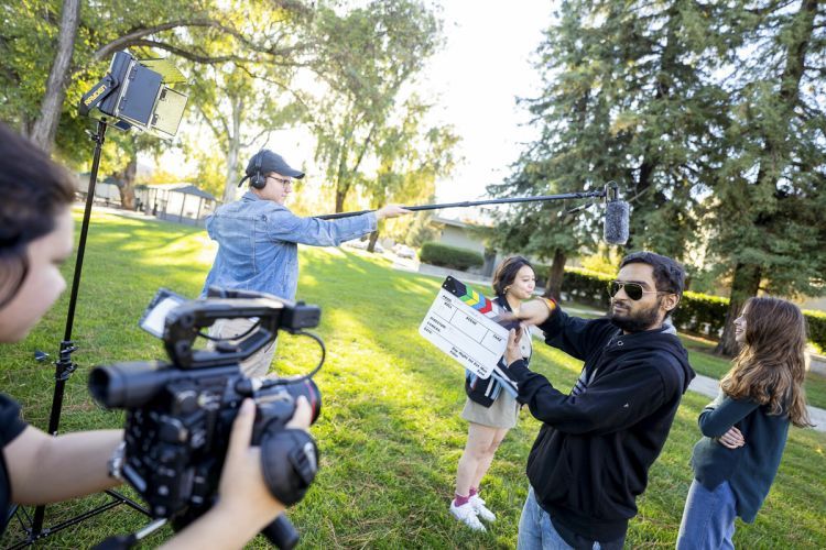 students work on video project