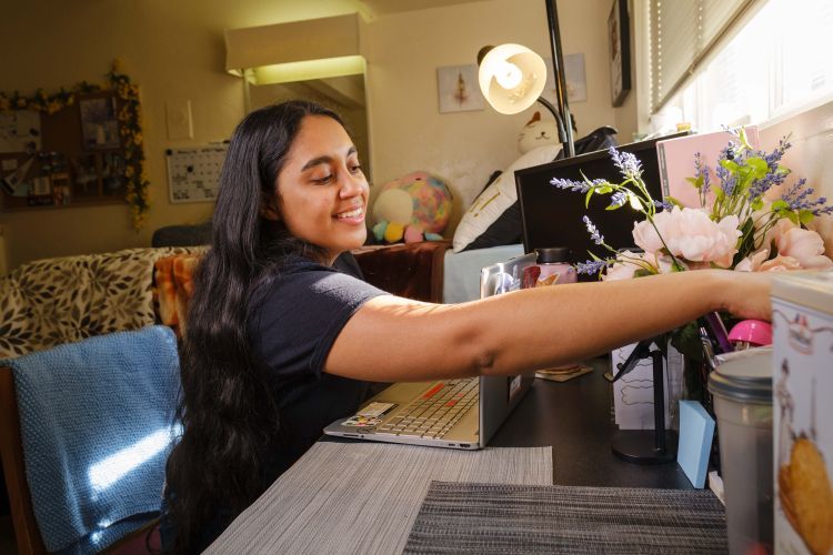 A student sits at a desk