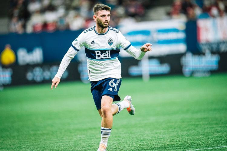 Vancouver Whitecaps' Tristan Blackmon is examined by a doctor after  colliding with Austin FC's Jhohan Romana during the first half of an MLS  soccer match Saturday, Oct. 1, 2022, in Vancouver, British