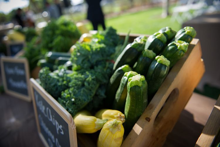 broccoli and zucchini displayed in wooden box