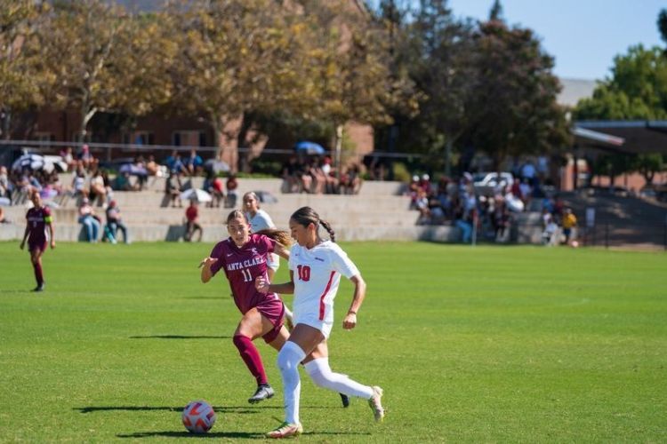 two soccer players on the field