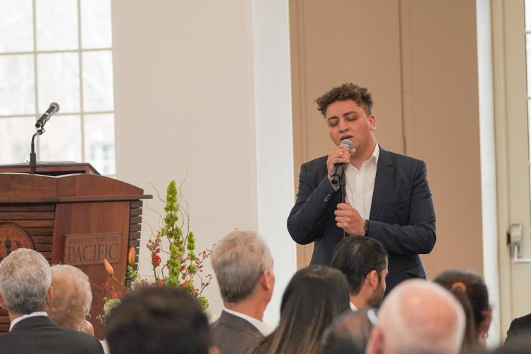 Filo Ebid performs a song during the luncheon