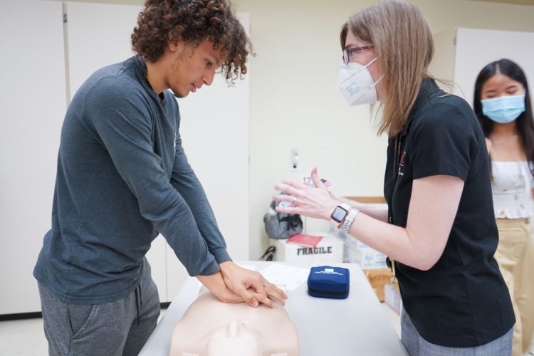 High school student with faculty member during Future Pharmacists at Pacific Summer High School Institute