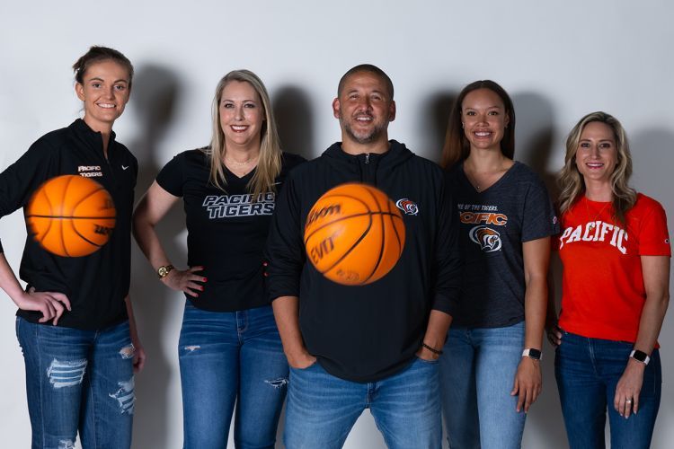 women's basketball coaches pose for a photo