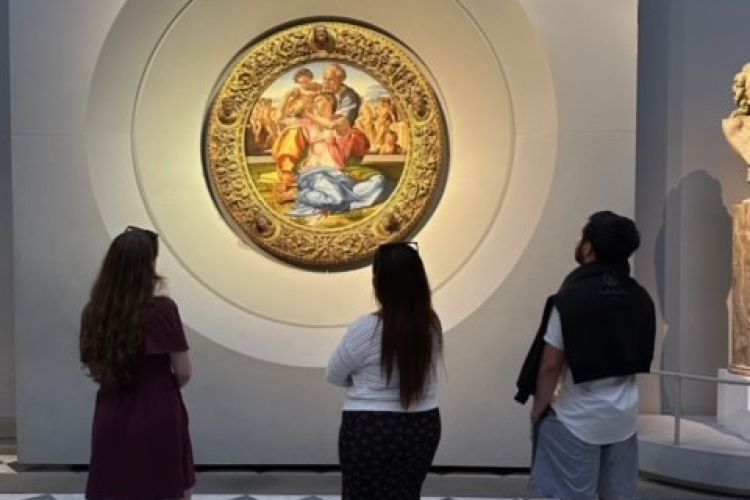 Sophie Briggs, Jordan Yang and José Solís with Michelangelo’s Doni Tondo at the Uffizi Gallery in Florence.