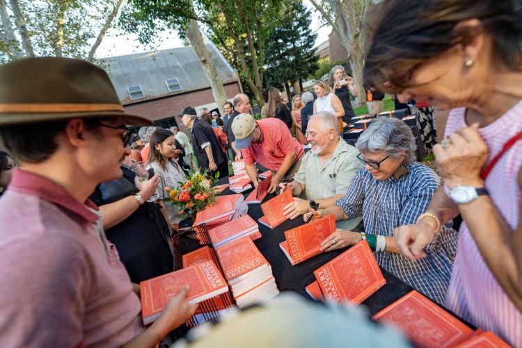 Faculty signed copies of "100 years in Stockton" at the event.