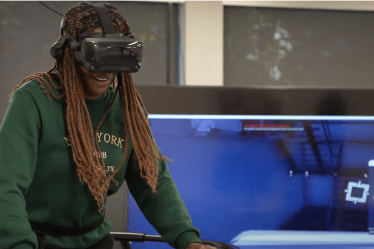 A student tries out a VR fitness game.