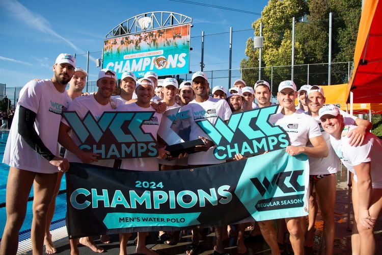 students hold a championship banner