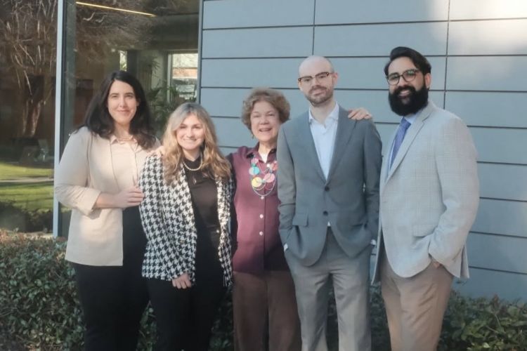 A group of five people outside