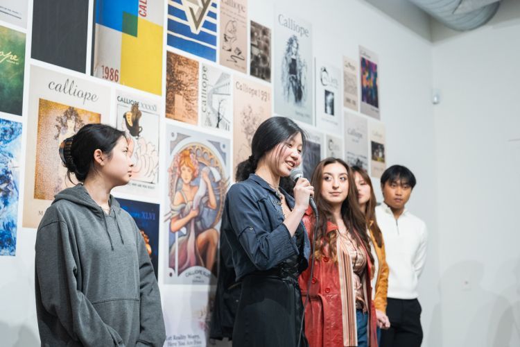 The student-led group responsible for curating "Muse: Calliope at 55" speaks to attendees.