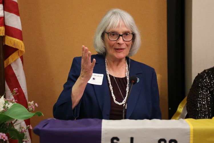 Marilyn Draheim stands at a podium