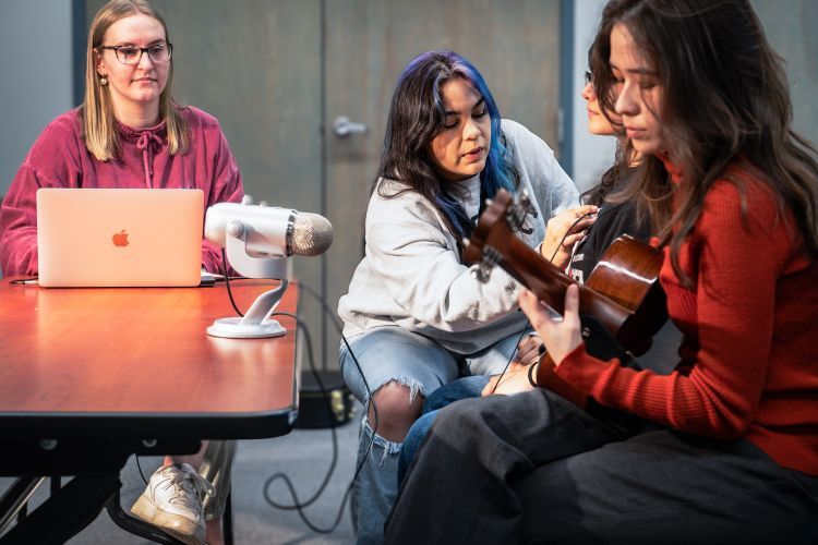 Students recording a song during music therapy class