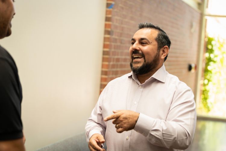 Marco Alvarado interacting with a student 