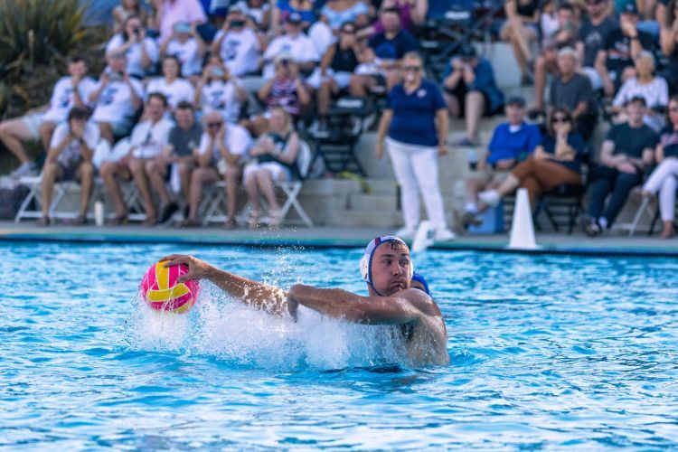 Alex Obert plays water polo in the pool