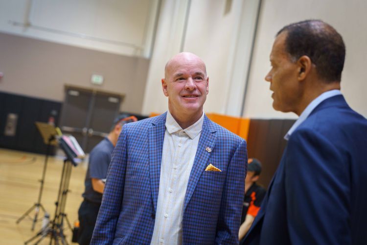 Dave Smart smiling in a blue suit