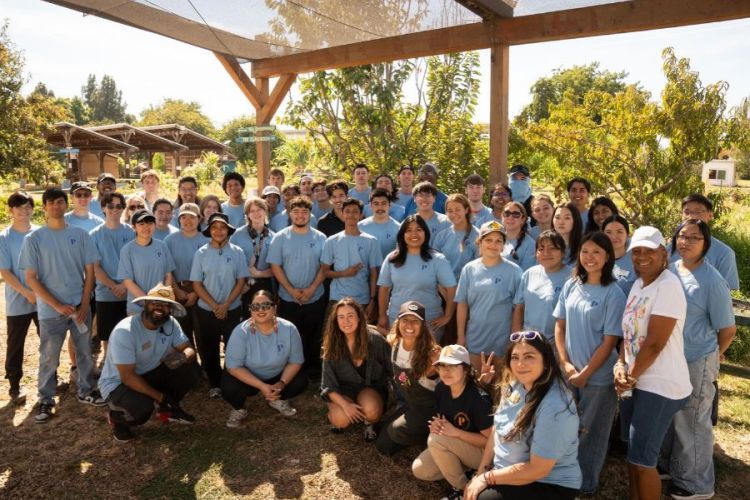 Group photo of all the students in blue tee shirts 