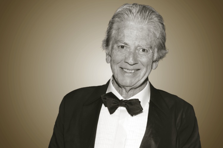 Photo of Bob Lee smiling, in a black and white suit.
