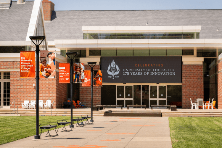 Light posts with flags on both sides and the new screens at the DUC