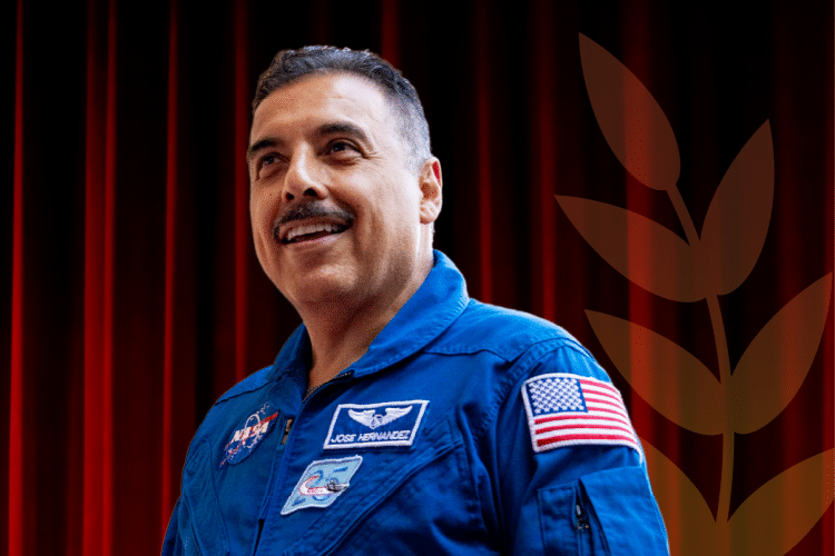 Jose smiles in a blue NASA uniform