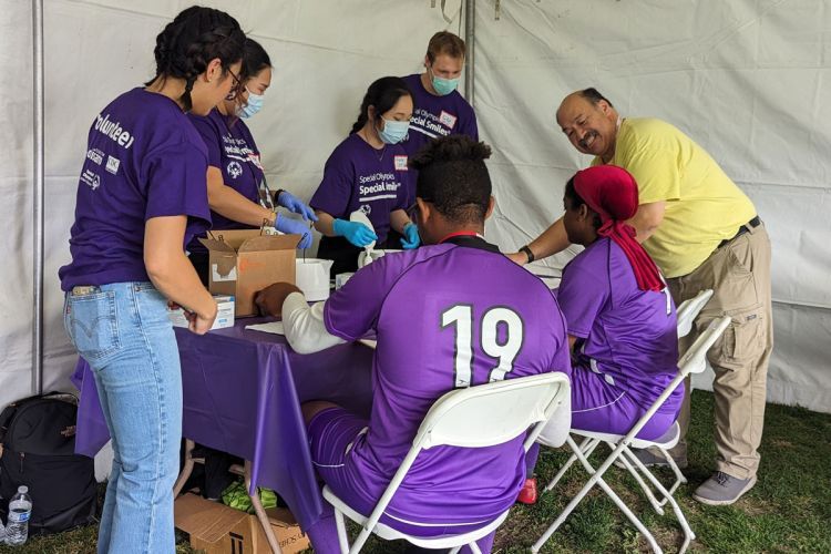 Special Olympics volunteers with athletes