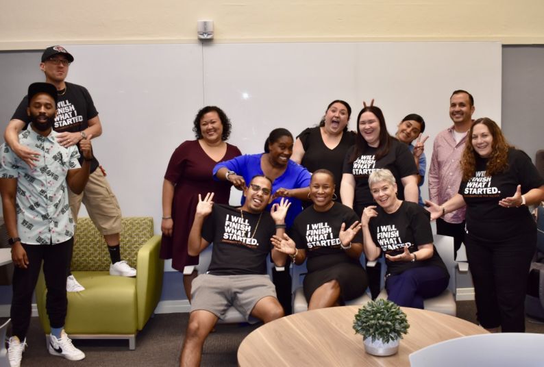 Students from the Organizational Leadership, Criminal Justice concentration posing inside Benerd College.