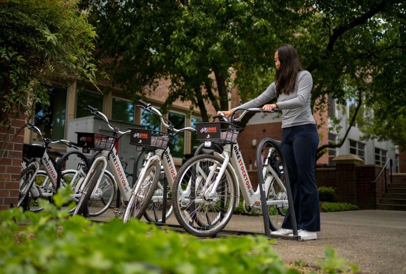 a student selects an e-bike from the on-campus hub