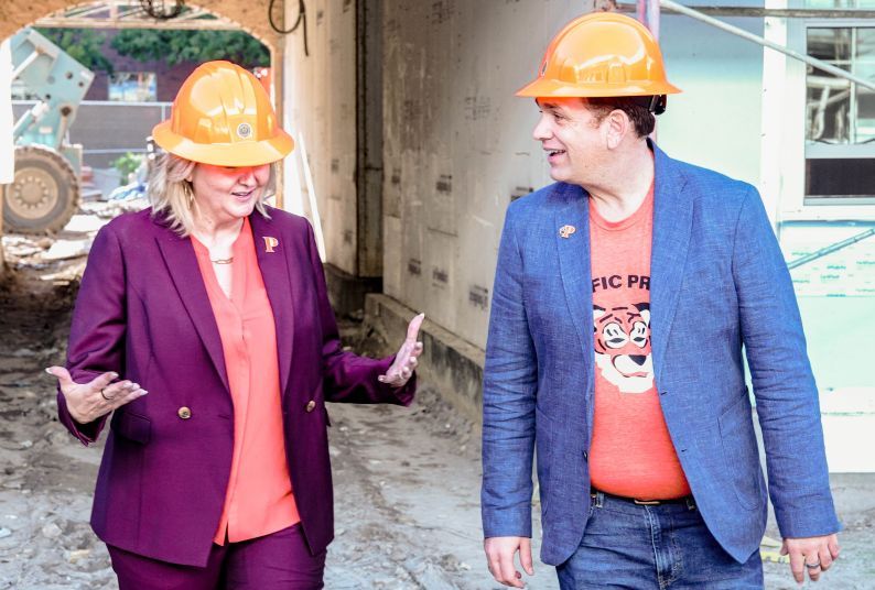 Maria Blandizzi and Josh O'Connor interacting 