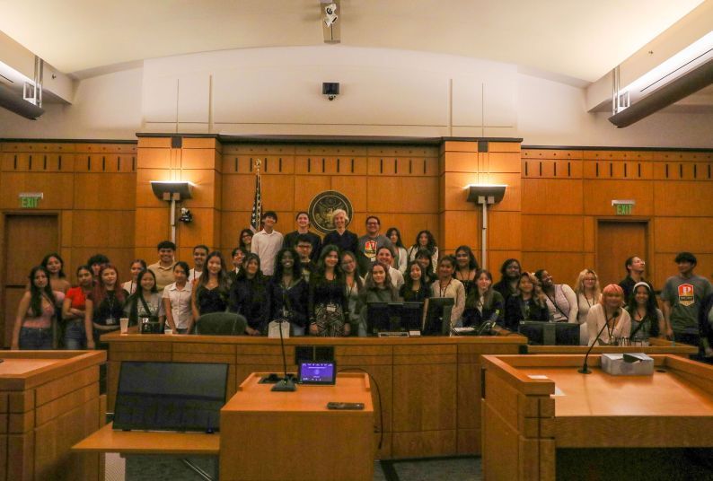A large group of people in a courtroom