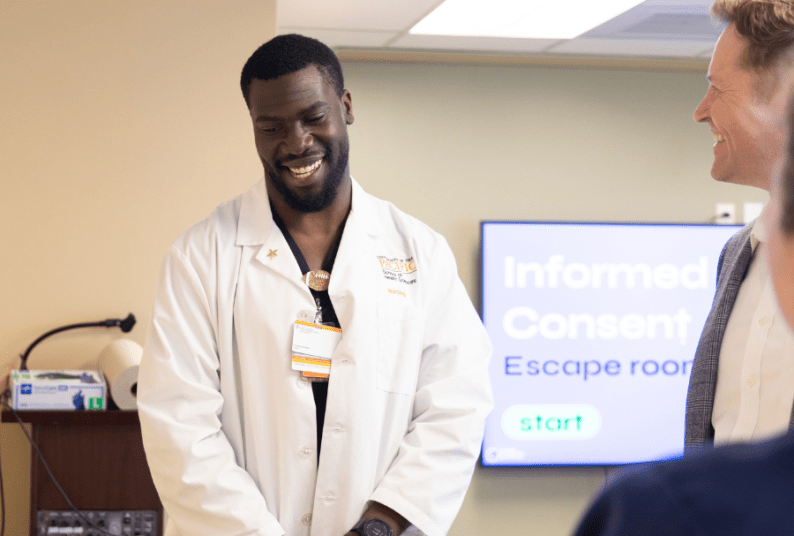 Nursing student in white lab coat