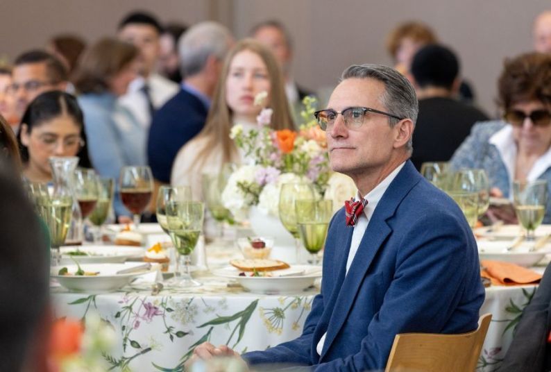 Michael Duffy sitting in a blue suit 