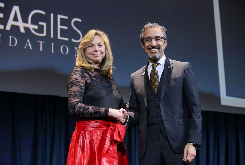 ADEA President and CEO Dr. Karen West congratulates Dr. Nader A. Nadershahi. (photo courtesy of ADEA)