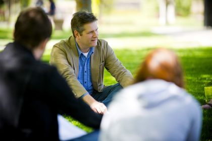 professor and students outdoors
