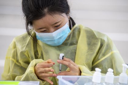 student drawing vaccine