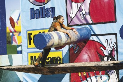 Brenna Crump climbs obstacle course