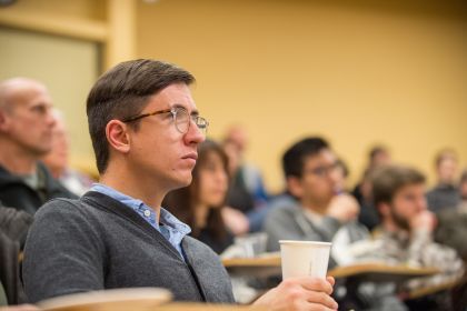 Students sit in a lecture hall