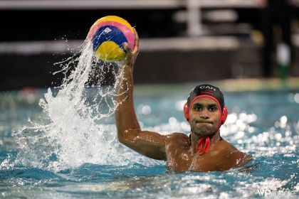 A men's water polo player competes in a game.