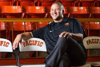 Bradley Davis sits on a chair with text that reads Pacific