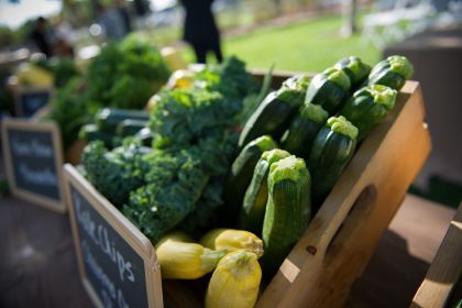 broccoli and zucchini displayed in wooden box