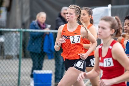 student-athletes running in track competition