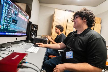 students practicing sound mixing in the recording studio 
