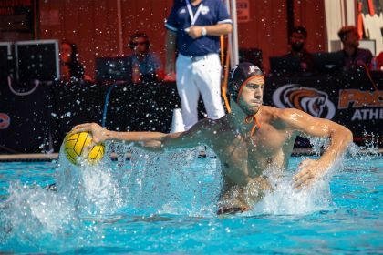 a water polo player prepares to throw the ball