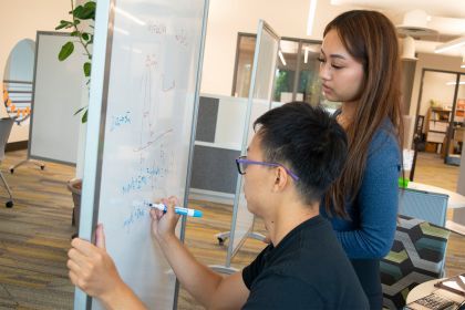 a student works with a peer tutor in the tutoring center