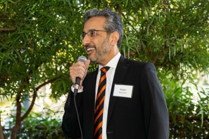 nader nadershahi speaks into a microphone