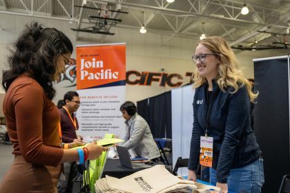 A student gets information at a booth during University of the Pacific's Career Expo.