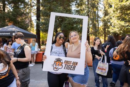 Students pose for a picture inside a white frame labeled "First-gen Tiger"