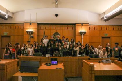 A large group of people in a courtroom