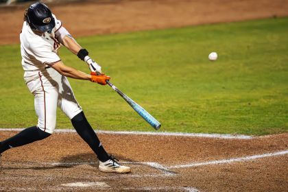 a baseball player hits the ball 
