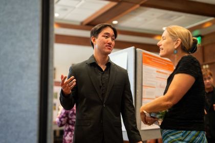 Student researcher talks to College of the Pacific dean Lee Skinner