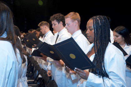 students reciting oath at White Coat Ceremony