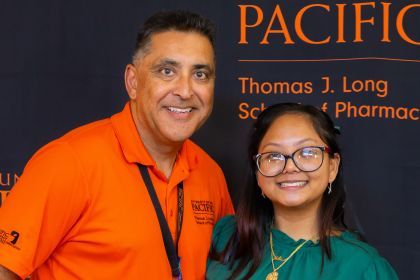 Associate Clinical Professor Rolly Kali-Rai with PharmD student